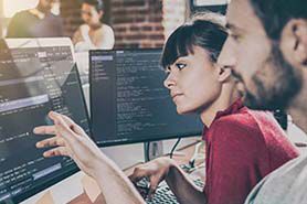 Man and woman looking at computer screen