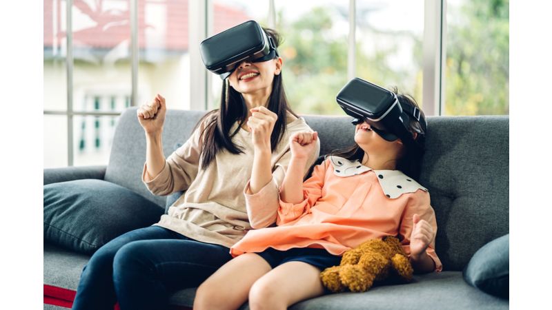 Mother and daughter playing virtual reality on high speed internet